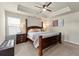 Bright main bedroom with a king-size bed and wood furniture at 2570 Reynolds Sw Rd, Atlanta, GA 30331