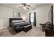 Large main bedroom with plush carpet and ceiling fan at 2570 Reynolds Sw Rd, Atlanta, GA 30331