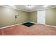 Finished basement room with carpet and a ping pong table at 2656 Old Norcross Rd, Tucker, GA 30084