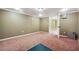 Spacious basement room with carpet and an open doorway at 2656 Old Norcross Rd, Tucker, GA 30084