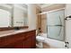 Bathroom with granite vanity, tiled shower, and bathtub at 2656 Old Norcross Rd, Tucker, GA 30084