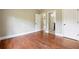 Spacious bedroom with hardwood floors and access to a bathroom at 2656 Old Norcross Rd, Tucker, GA 30084