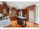 Kitchen boasts granite countertops and dark wood cabinetry at 2656 Old Norcross Rd, Tucker, GA 30084