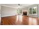 Large living area with hardwood floors and a brick fireplace at 2656 Old Norcross Rd, Tucker, GA 30084