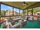 Relaxing screened porch with seating area and ceiling fan at 2656 Old Norcross Rd, Tucker, GA 30084