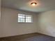 Well-lit bedroom featuring a window and carpet at 6354 Shannon Pkwy # 6D, Union City, GA 30291