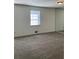 Spacious carpeted bedroom with a window and mirrored wall at 6354 Shannon Pkwy # 6D, Union City, GA 30291