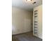 Well-lit bedroom with built-in shelving and neutral carpeting at 6354 Shannon Pkwy # 6D, Union City, GA 30291