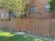 Brick building exterior with wooden fence and gate at 6354 Shannon Pkwy # 6D, Union City, GA 30291