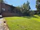 Brick building with grassy backyard and fence at 6354 Shannon Pkwy # 6D, Union City, GA 30291