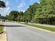 Road view with trees and landscaping at 6354 Shannon Pkwy # 6D, Union City, GA 30291