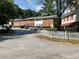 Row of brick townhouses with white picket fence at 6354 Shannon Pkwy # 6D, Union City, GA 30291