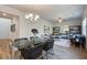 Bright dining room features a glass-top table and chairs, hardwood floors, and a chandelier at 746 River Gardens Se Dr, Atlanta, GA 30354