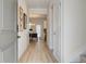 Light and bright entryway with luxury vinyl plank flooring and view to the living area at 746 River Gardens Se Dr, Atlanta, GA 30354