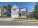 Two-story Craftsman style home with gray siding, white trim, and a two-car garage at 746 River Gardens Se Dr, Atlanta, GA 30354