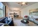 Open concept living room with a view into the kitchen and a comfy seating area at 746 River Gardens Se Dr, Atlanta, GA 30354