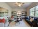 Relaxing living room features a neutral color scheme, plush seating, and a ceiling fan at 746 River Gardens Se Dr, Atlanta, GA 30354