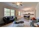 Open living room with a view of the kitchen and access to a back deck at 746 River Gardens Se Dr, Atlanta, GA 30354