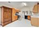 Kitchen with ample wood cabinets and an armoire at 990 Avalon Dr, Lawrenceville, GA 30044