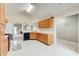 Galley kitchen with wood cabinets and stainless steel appliances at 990 Avalon Dr, Lawrenceville, GA 30044