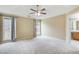 Spacious main bedroom with large windows and ceiling fan at 990 Avalon Dr, Lawrenceville, GA 30044