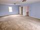 Primary bedroom with carpet and multiple doors at 105 Pine Valley Rd, Hiram, GA 30141