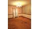 Empty dining room with brown carpet and patterned wallpaper at 105 Pine Valley Rd, Hiram, GA 30141