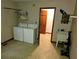 Laundry room with washer, dryer, utility sink, and ample storage at 105 Pine Valley Rd, Hiram, GA 30141