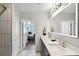 Modern bathroom with double vanity, large mirror, and walk-in shower at 855 Peachtree Ne St # 2911, Atlanta, GA 30308