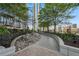 Landscaped patio with a winding path and water feature at 855 Peachtree Ne St # 2911, Atlanta, GA 30308