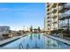 Resort-style rooftop pool with plenty of lounge chairs at 855 Peachtree Ne St # 2911, Atlanta, GA 30308