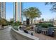 Seating area near a water fountain, surrounded by greenery at 855 Peachtree Ne St # 2911, Atlanta, GA 30308