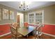 Bright dining room with wood floors and wood table at 114 Delta Ct, Sharpsburg, GA 30277