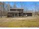 Back of house showing deck and screened porch at 114 Delta Ct, Sharpsburg, GA 30277