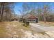 Side view of house with garage and driveway at 114 Delta Ct, Sharpsburg, GA 30277