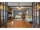 Living room with hardwood floors and stone fireplace at 114 Delta Ct, Sharpsburg, GA 30277