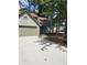 House exterior boasts a two-car garage and landscaped yard at 1442 Bailing Dr, Lawrenceville, GA 30043