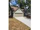 House exterior boasts a two-car garage and landscaped yard at 1442 Bailing Dr, Lawrenceville, GA 30043