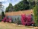 Landscaped backyard with a stylish wooden fence and colorful plants at 2540 Village Park Dr, Cumming, GA 30041