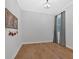 Simple bedroom with hardwood floors, neutral walls, and a window with natural light at 2540 Village Park Dr, Cumming, GA 30041