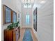 Bright foyer featuring hardwood floors, shiplap walls, stylish decor, and a welcoming ambiance at 2540 Village Park Dr, Cumming, GA 30041