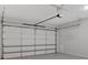 A spacious garage with a white door and automatic opener providing secure parking and storage at 2540 Village Park Dr, Cumming, GA 30041