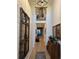 Elegant hallway featuring hardwood floors, and a stylish wooden cabinet at 2540 Village Park Dr, Cumming, GA 30041