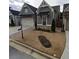 Gray exterior house with stone accents and a metal roof at 2540 Village Park Dr, Cumming, GA 30041