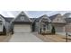 Gray exterior house with stone accents and a metal roof at 2540 Village Park Dr, Cumming, GA 30041