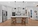 Stylish kitchen with white cabinetry, stainless steel appliances, and decorative tile island at 2540 Village Park Dr, Cumming, GA 30041