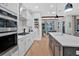 Modern kitchen with stainless appliances and a view into the dining area at 2540 Village Park Dr, Cumming, GA 30041