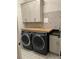 Laundry room with butcher block countertop and cabinets at 2540 Village Park Dr, Cumming, GA 30041