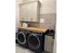 Laundry room with butcher block countertop and modern appliances at 2540 Village Park Dr, Cumming, GA 30041