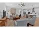 Inviting living room open to the kitchen with hardwood floors and modern furnishings at 2540 Village Park Dr, Cumming, GA 30041